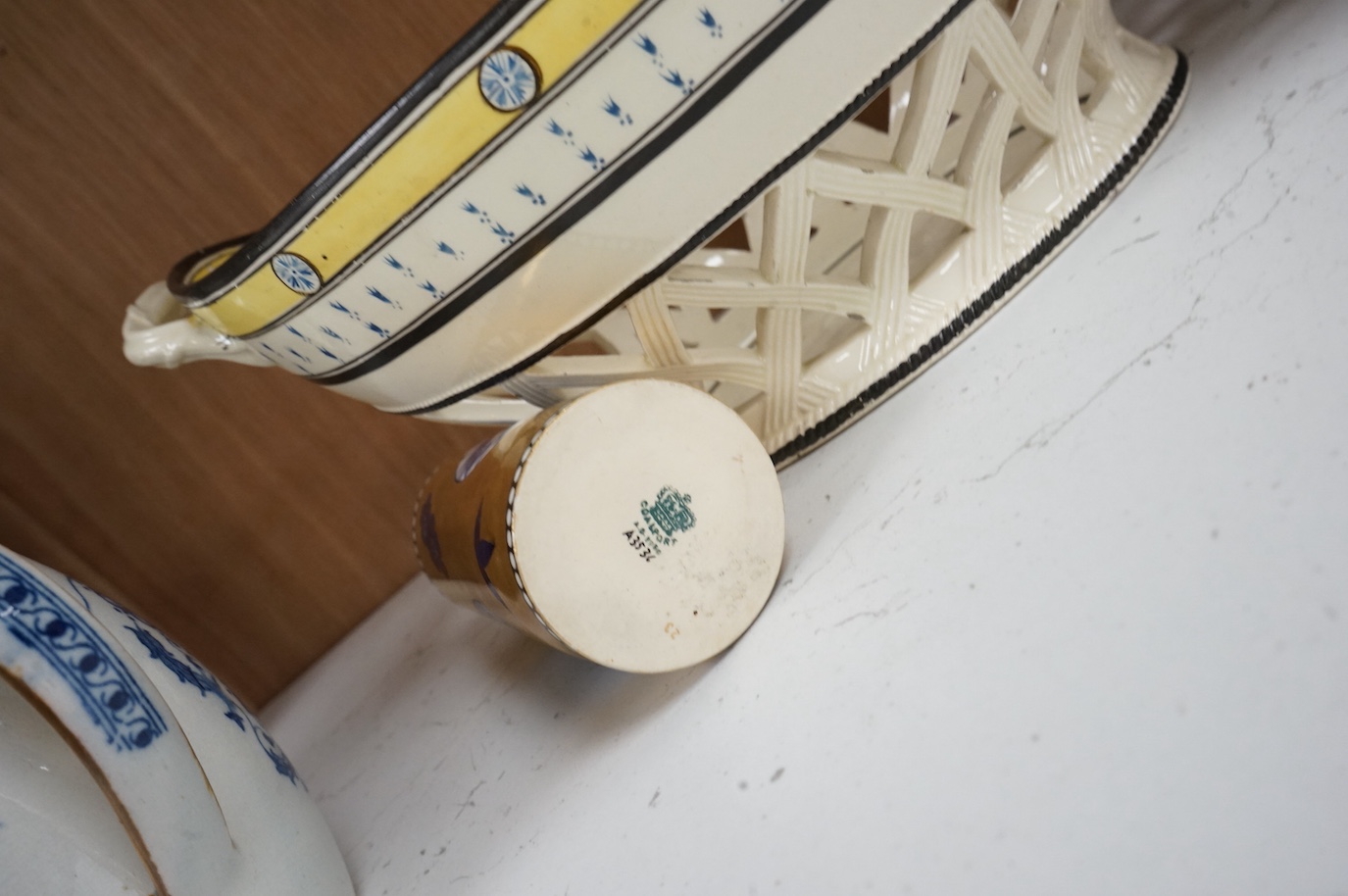 A George III creamware basket, a pearlware mug and jug, a Coalport spill vase (four), basket 26.5cm handle to handle.